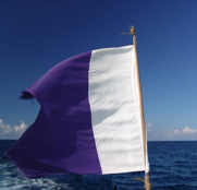 Alpha code flag.  White and blue signals that a vessel has a diver down.